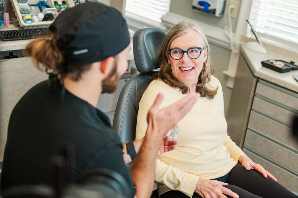 Dr Henley explaining dental implant procedure to patient